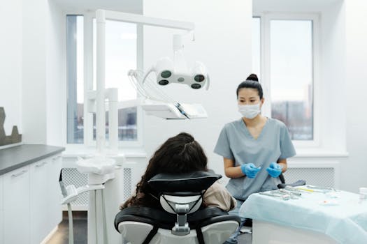 Dentist with a patient in a modern dental clinic performing an examination.